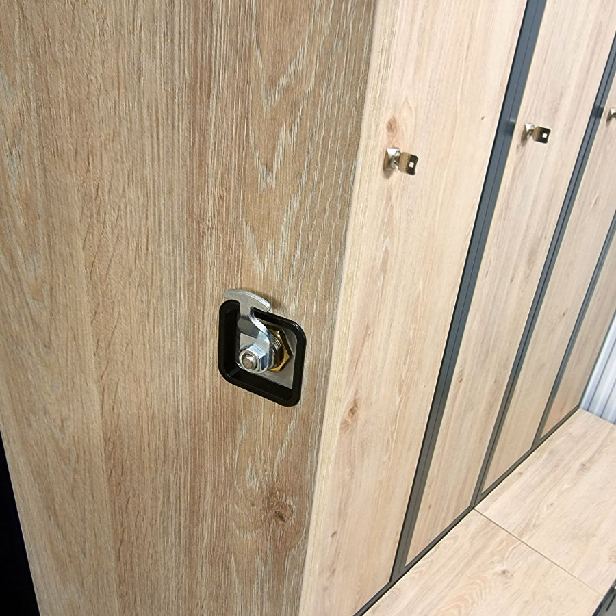 Metal garment locker doors and seating areas in the Oak - Davos wood decor