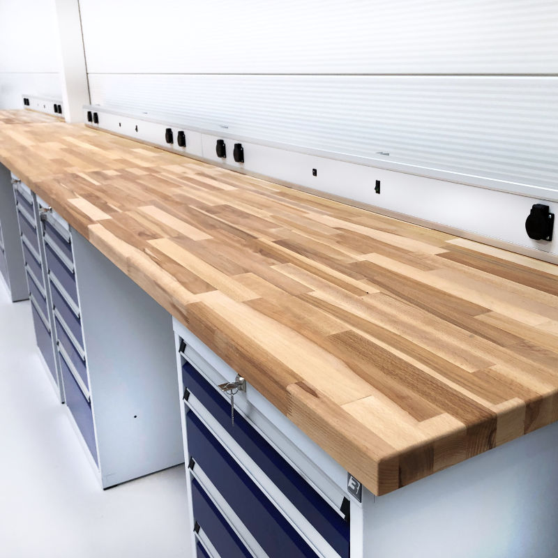 View of a workshop workbench worktop fitted with massive beech battenboard