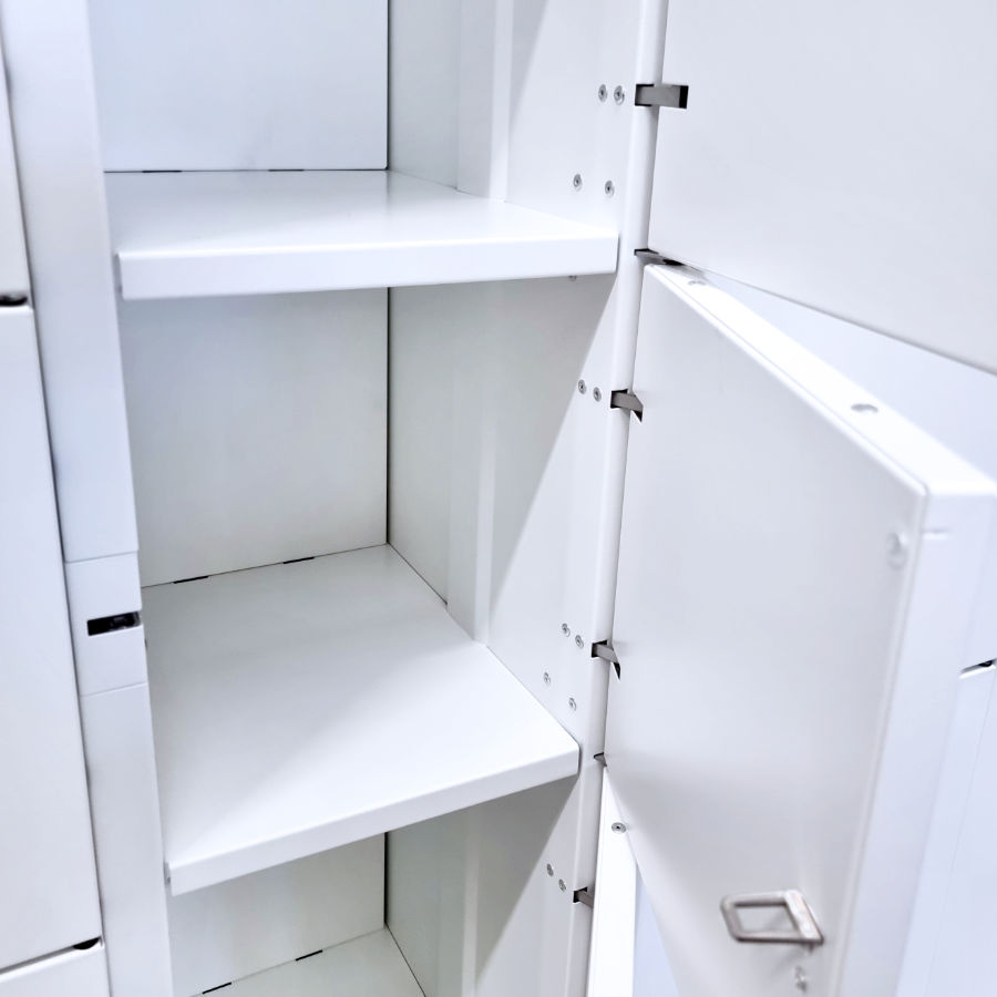 Door damping elements and door opening angle limiters of an interior metal parcel locker